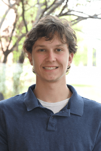 Employee headshot in front of a tree