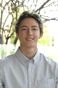 Employee headshot in front of a tree