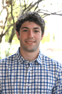 Employee headshot in front of a tree